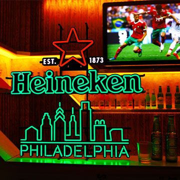 What are some specific examples and effects of neon in commercial advertising?