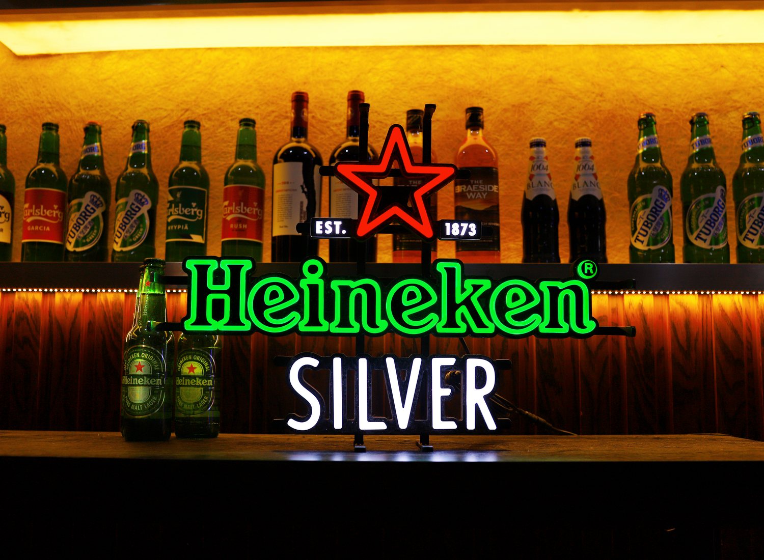 RUOMEI-produced LED neon sign installed in a bar display