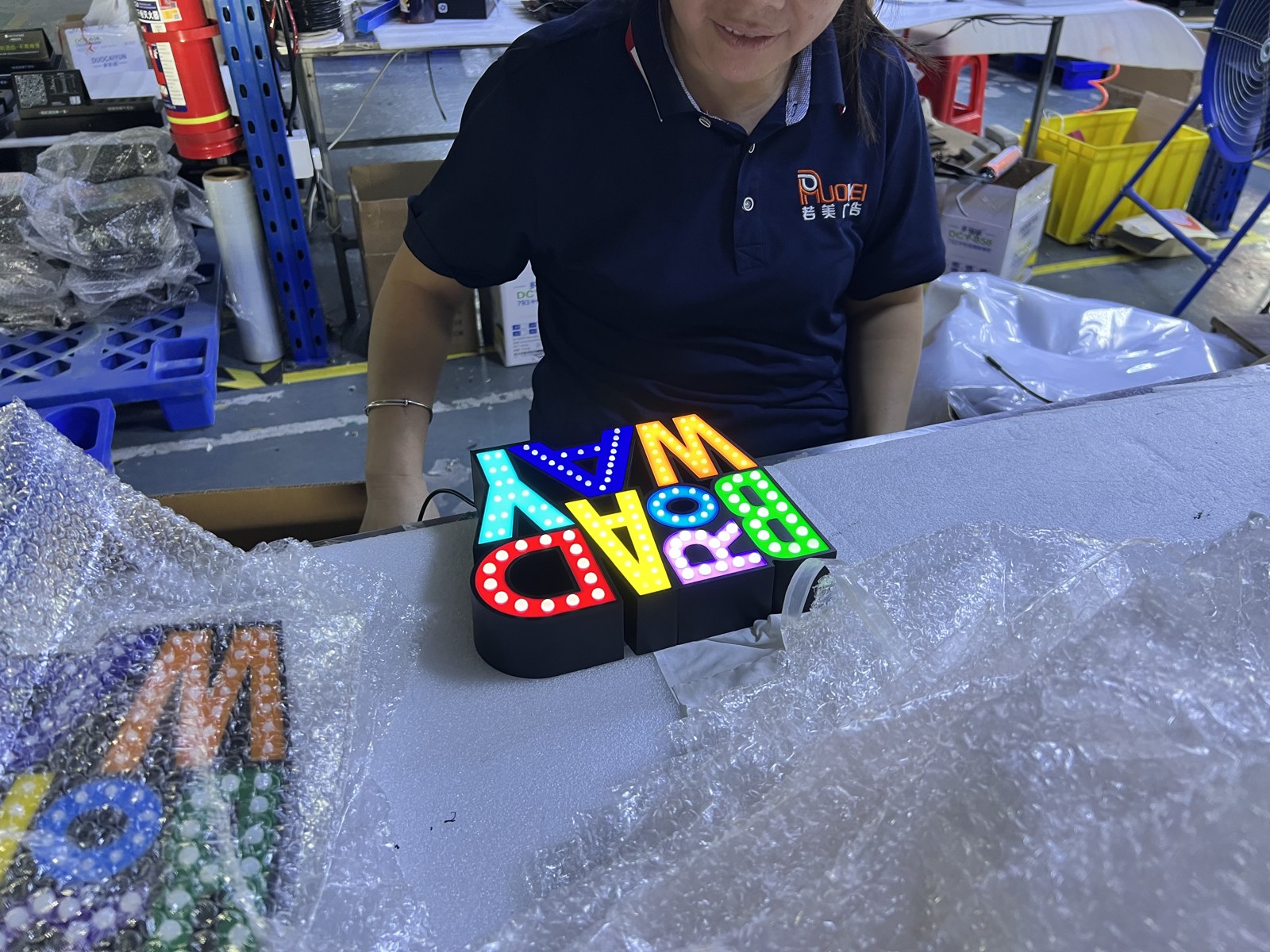 Finished BROADWAY illuminated sign on a workbench