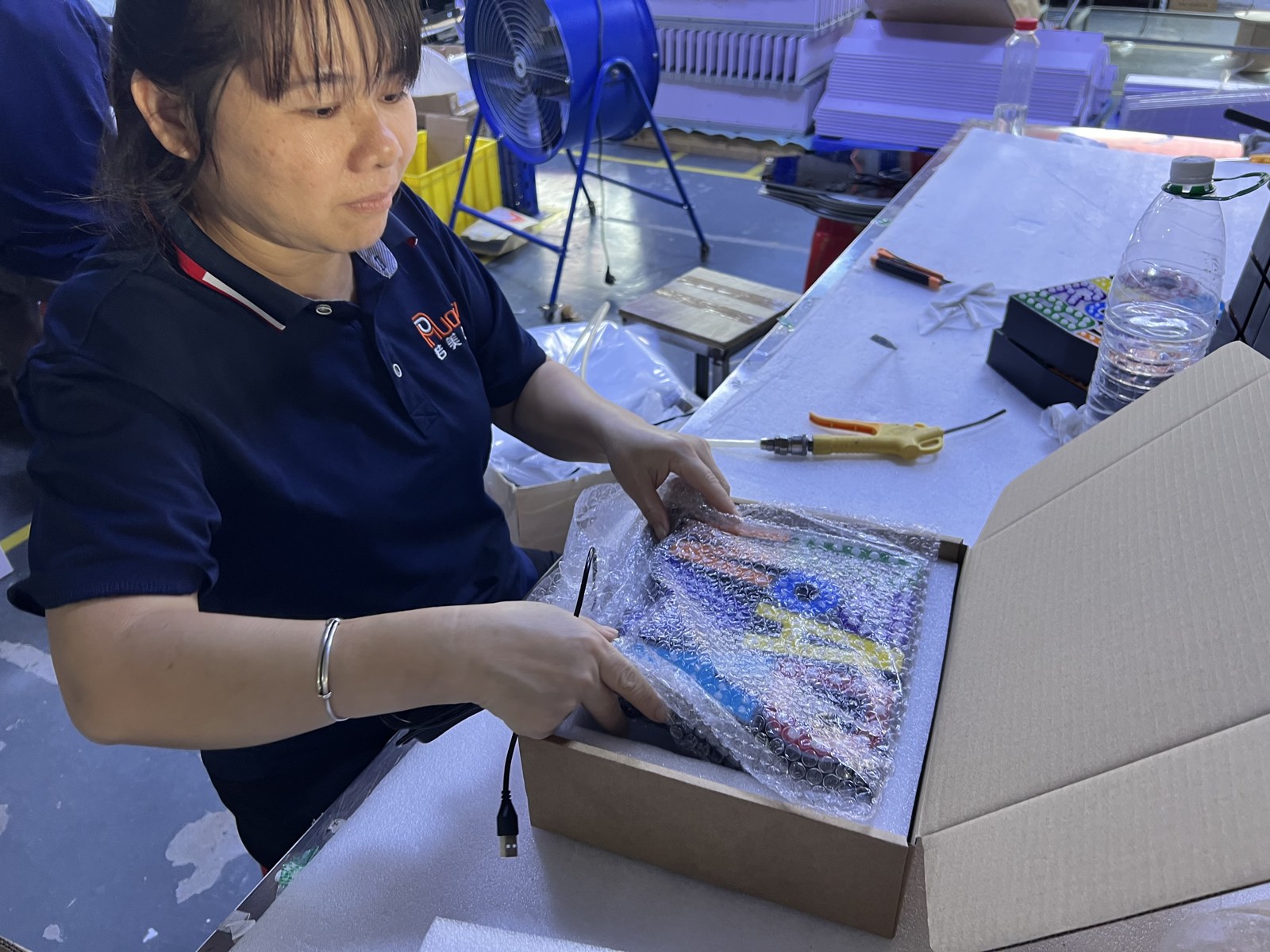 Wrapped BROADWAY sign being placed in protective foam