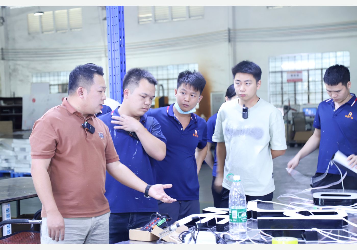 Factory team reviewing a sign project