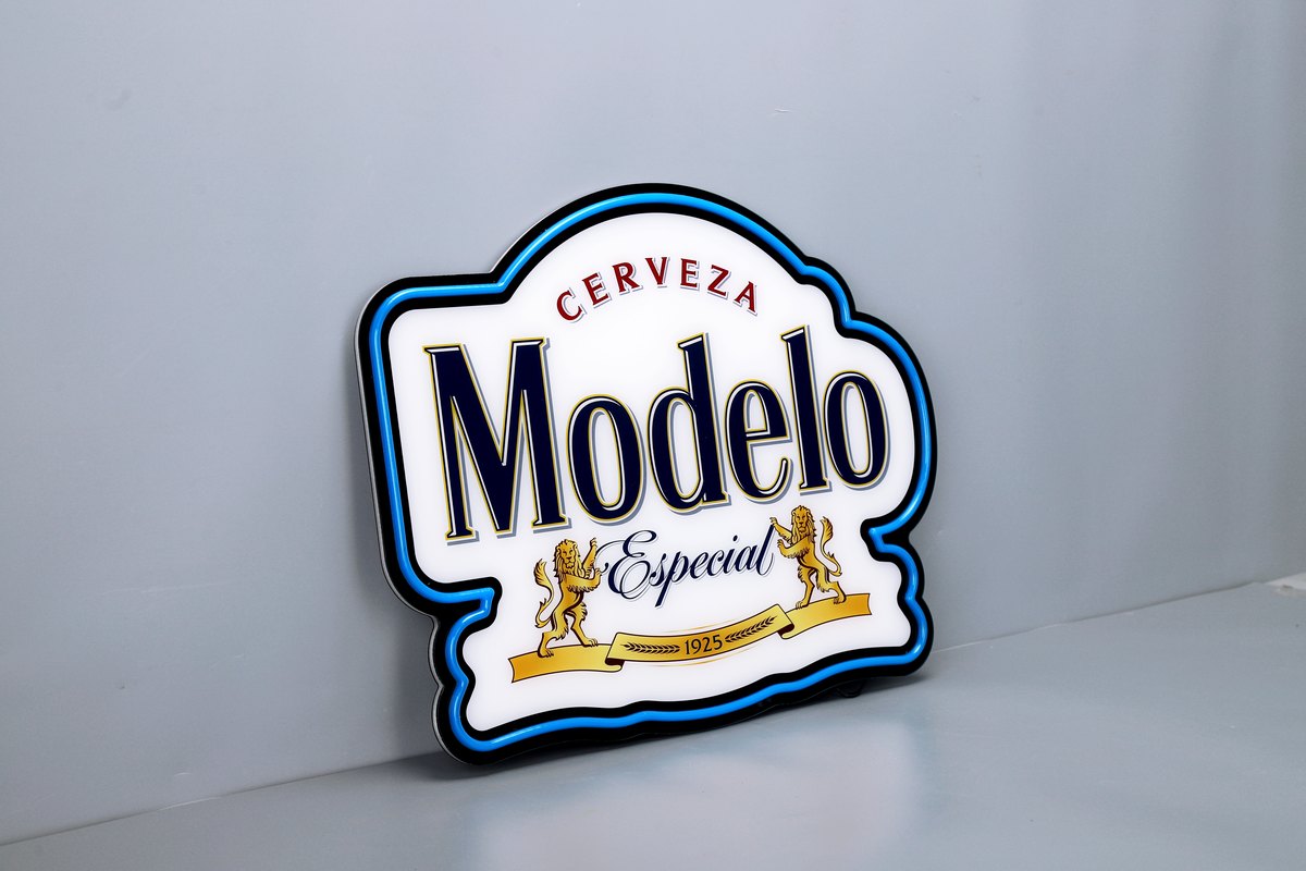Complete illuminated logo light box photographed against a plain background