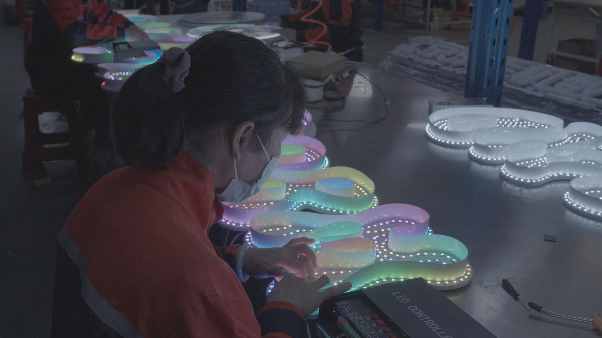 Illuminated LED products being checked on the production floor